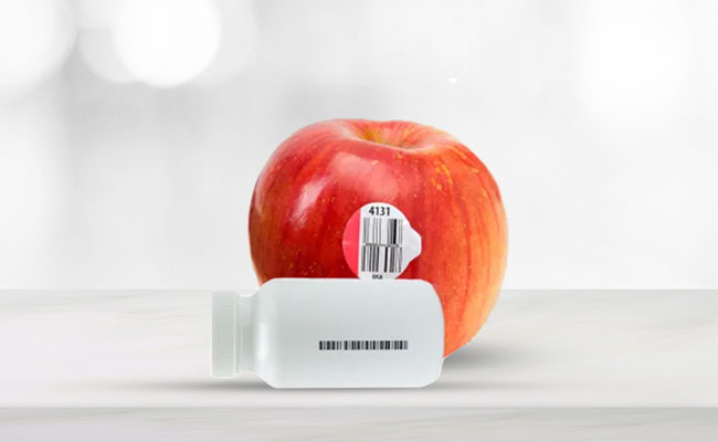 Lot Tracking Barcodes on a Red Apple and White Pill Bottle